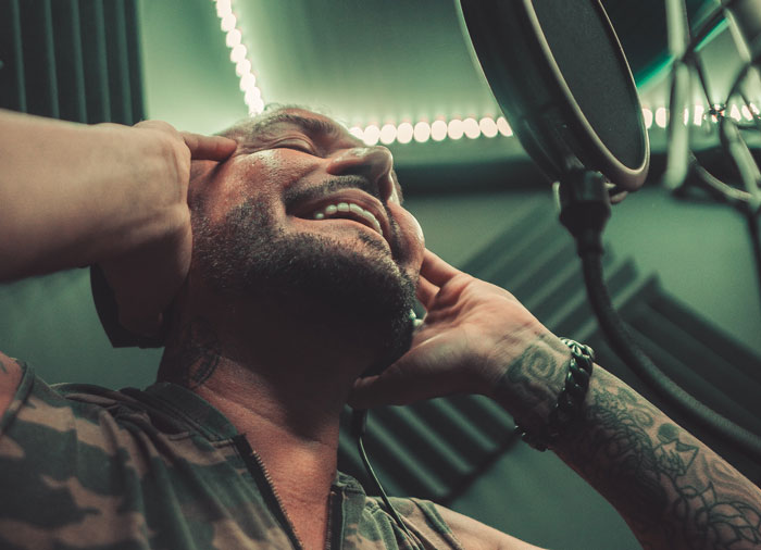 man singing into a microphone